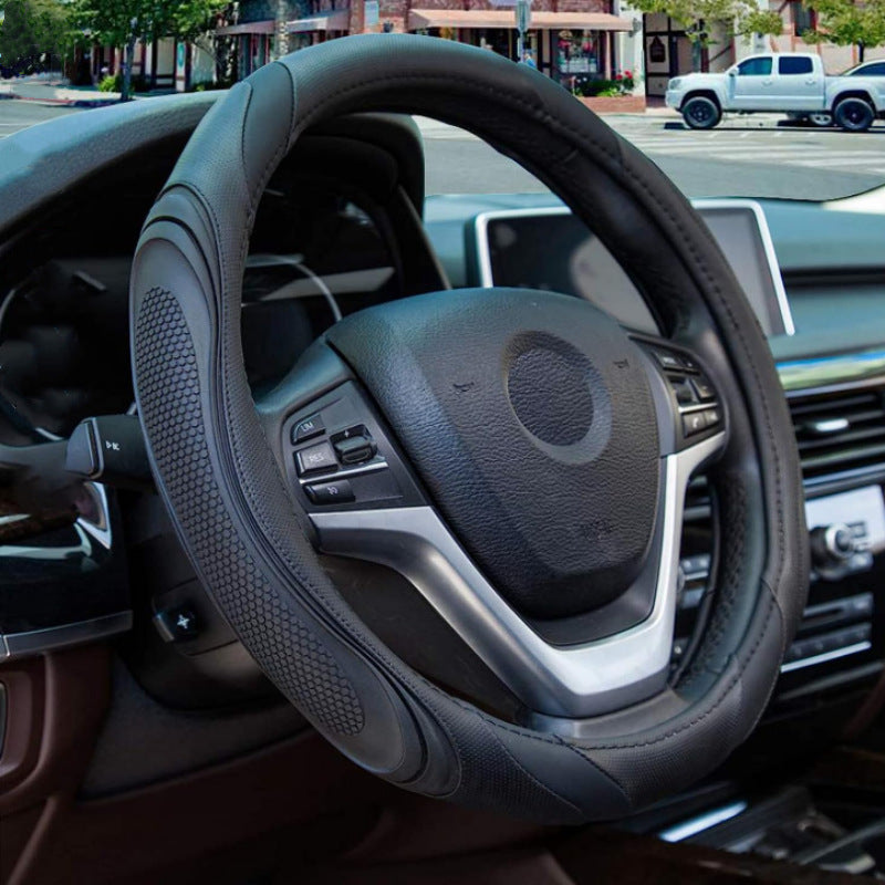 Cross-border stitching car steering wheel cover four seasons universal nail yarn film leather handle cover concave-convex massage car handle cover